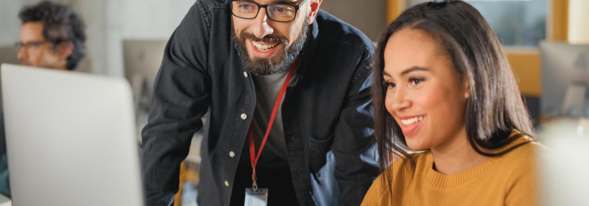 Tech professional helping person with their computer